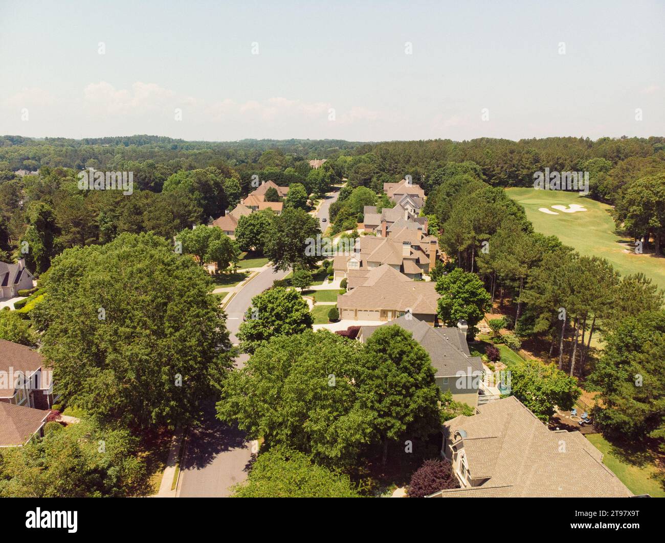 Aerial panoramic view of house cluster in a sub division in Suburbs with golf course and lake in metro Atlanta in Georgia ,USA shot by drone shot duri Stock Photo