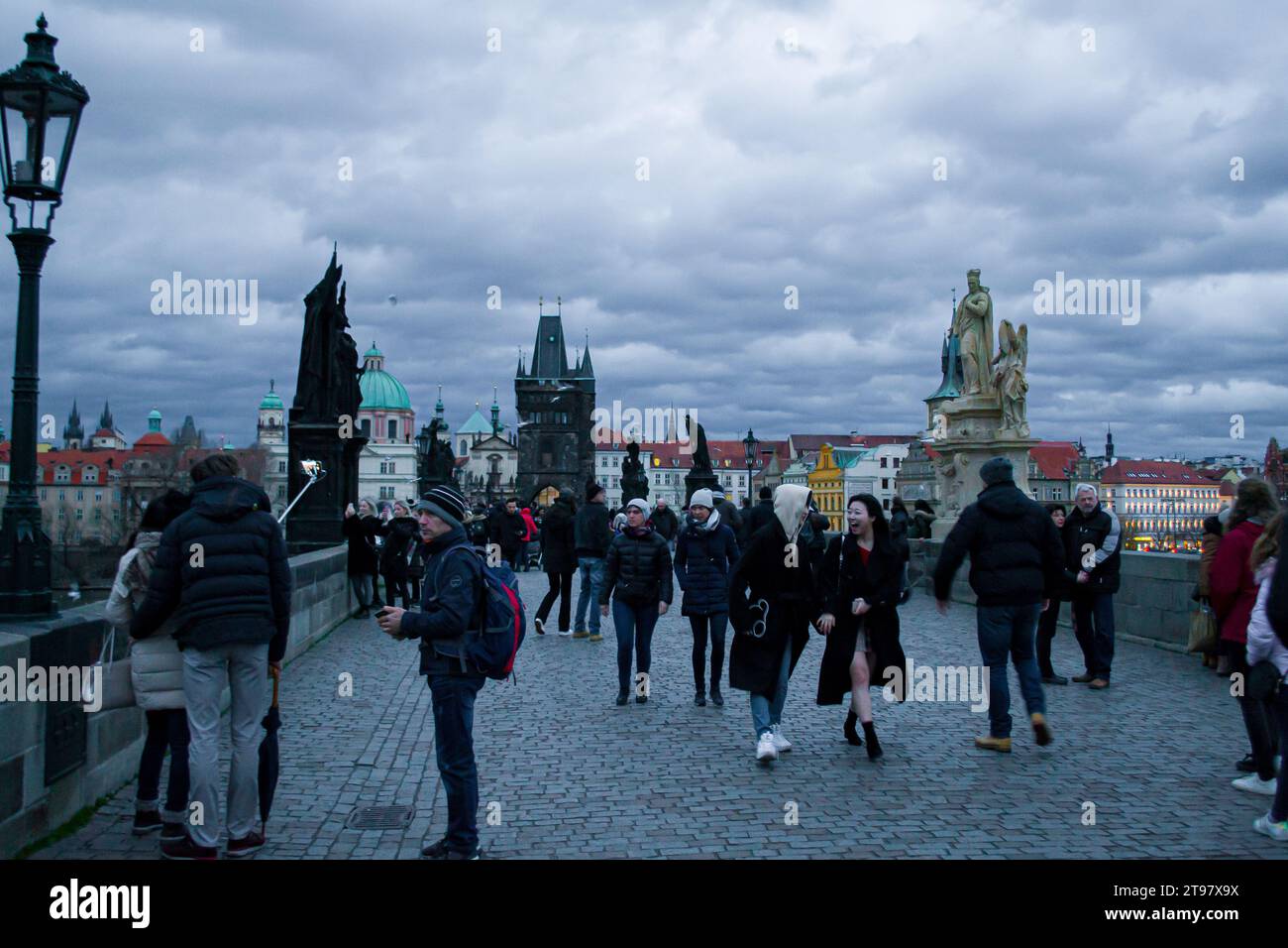 People walking on the Charles Bridge in Prague Stock Photo