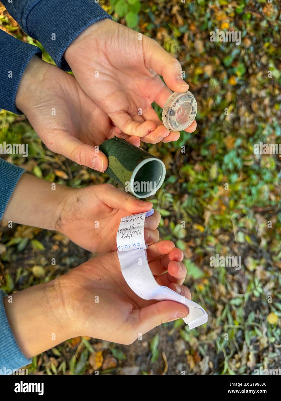 A Geocaching Find in the hands of 2 Children Stock Photo Alamy