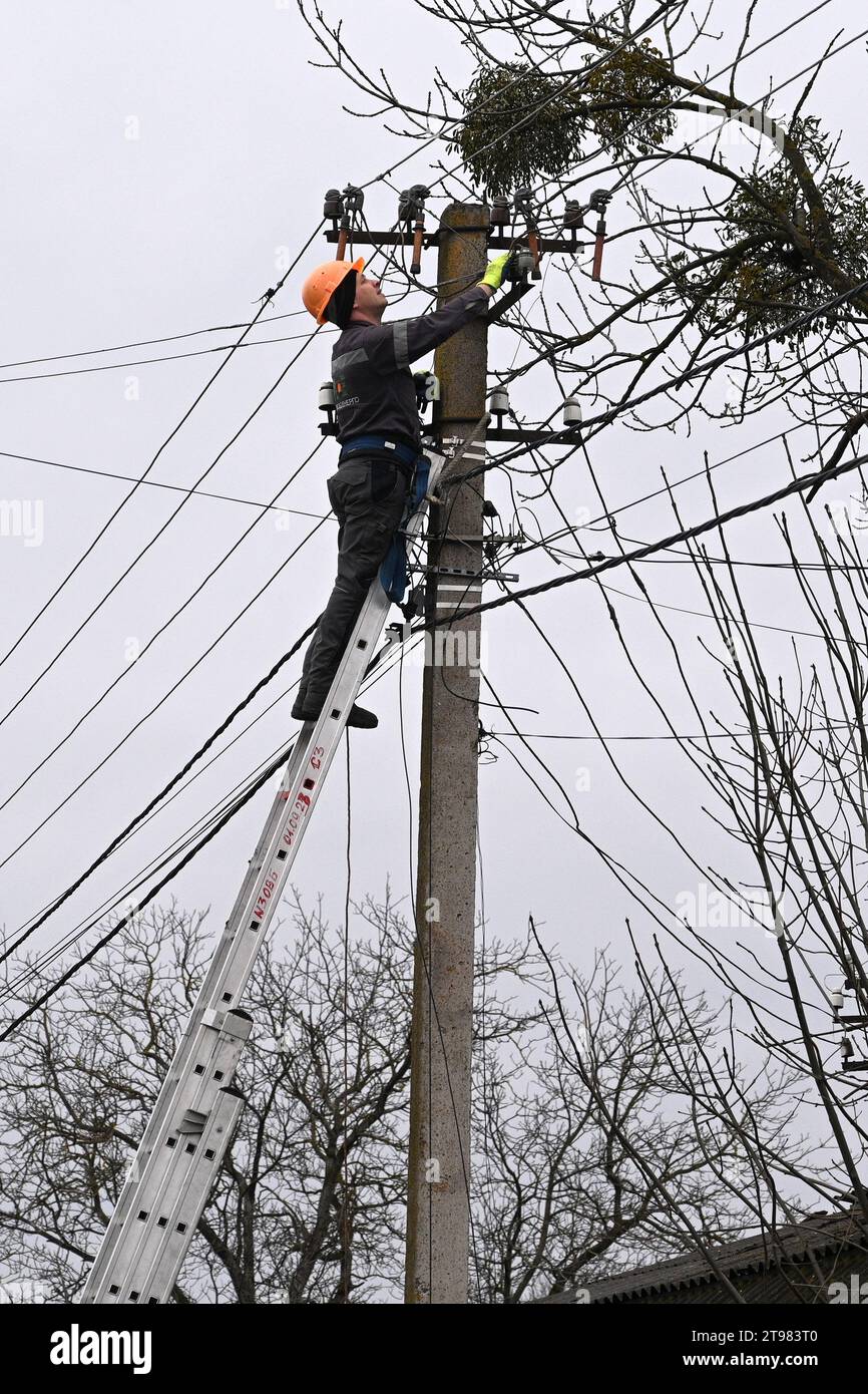 Velyka Vilshanytsia, Ukraine - March 9, 2023: A worker repairs a power line following a Russian missile strike in Lviv region. Stock Photo
