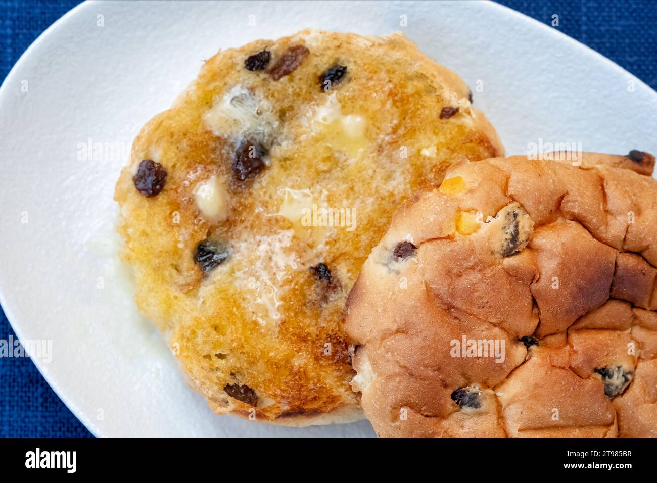 A large warm toasted traditional English fruited teacake. The teacake