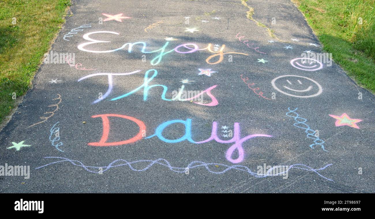 Uplifting Chalk Art 'Enjoy This Day' Stock Photo