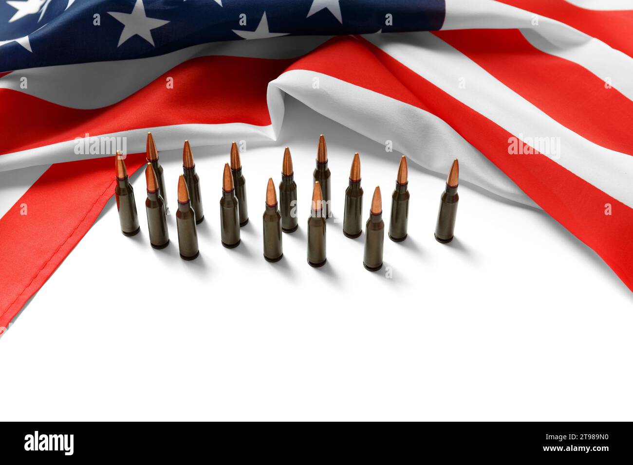 American flag, bullets, ammunition, cartridges for firearms on a white background. The concept of lend-lease, support, arms sales Stock Photo
