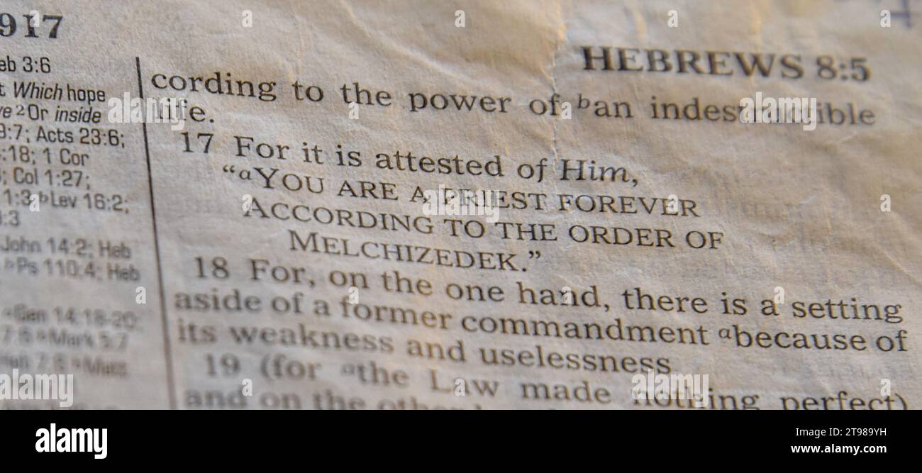 Opened Bible Hebrews 7:17 Stock Photo - Alamy
