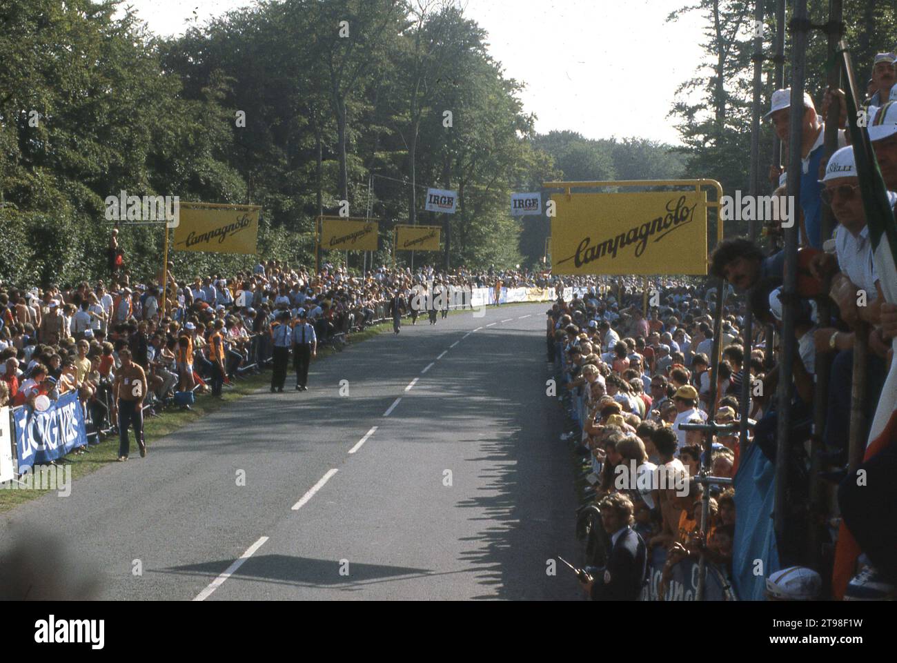 1982, spectators line the finish straight at the UCI World Cycling Championships held at the famous Goodwood motoring circuit, Chichester, West Sussex, England, UK. The exciting race as won by Italian Giuseppe Sarroni, who beat cycling legends, Greg LeMond and Sean Kelly with his final sprint for victory, giving him the nickmane of 'La fulcilata di Goodwood', the gunshot of Goodwood. Mandy Jones of Great Britain won the women's road race. Stock Photo