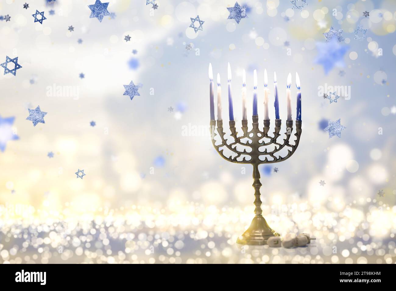 Happy Hanukkah. Candles lit in menorah. Family celebration of Jewish holiday. Stock Photo