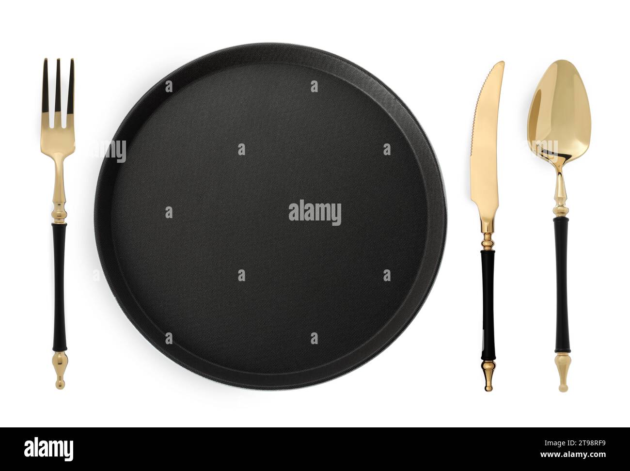 Empty black plate with fork, knife and spoon on white background, top view Stock Photo