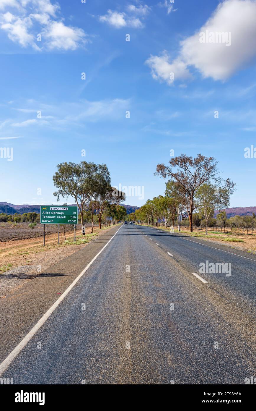 Road sign for Alice Springs, Darwin and the Stuart Highway in Australia's Northern Territory Stock Photo