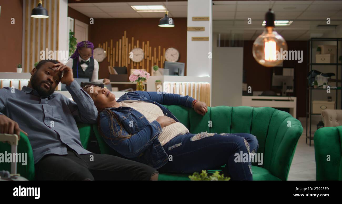 African couple sleeping on sofa hi-res stock photography and images - Alamy