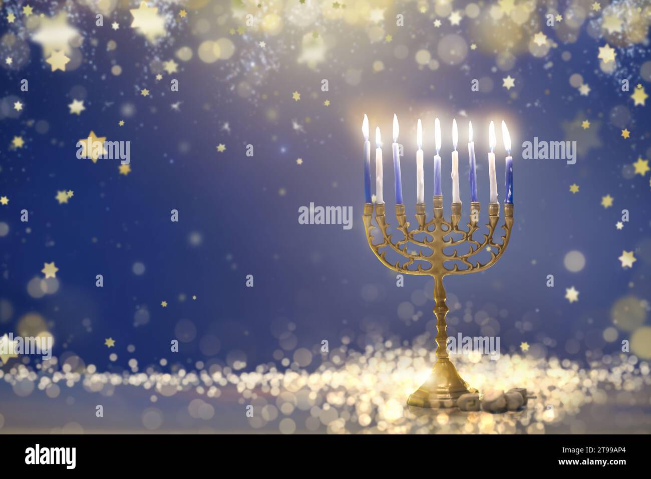 Happy Hanukkah. Candles lit in menorah. Family celebration of Jewish holiday. Stock Photo