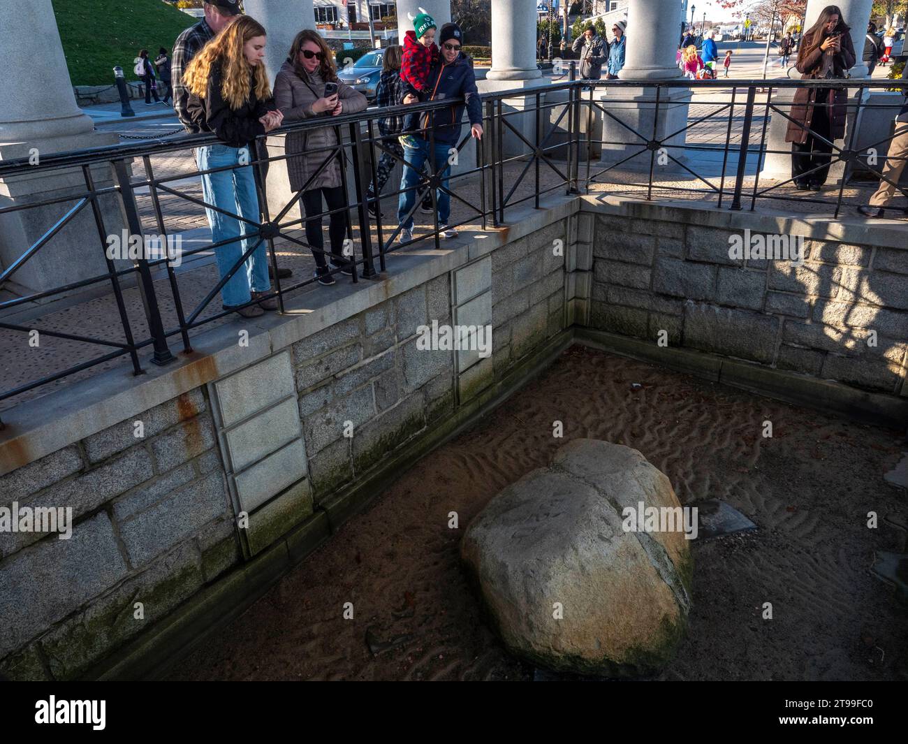 Plymouth, Massachusetts, USA. 23rd Nov, 2023. Tourists look at Plymouth Rock, which is the traditional site of disembarkation of the Mayflower Pilgrims who founded Plymouth Colony in December 1620. (Credit Image: © Sue Dorfman/ZUMA Press Wire) EDITORIAL USAGE ONLY! Not for Commercial USAGE! Stock Photo