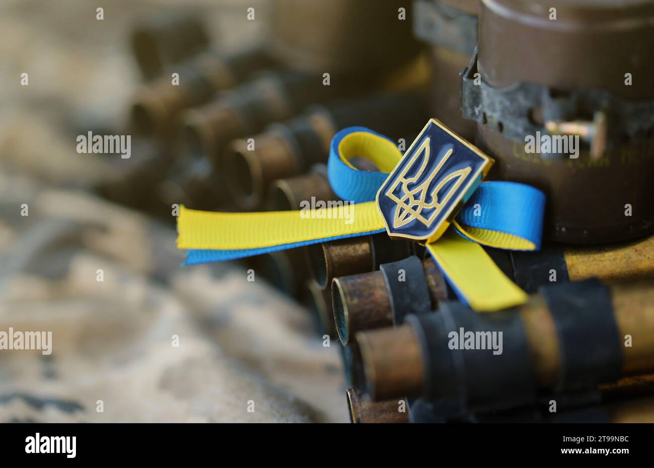 Ukrainian symbol on machine gun belt lies on ukrainian pixeled military ...
