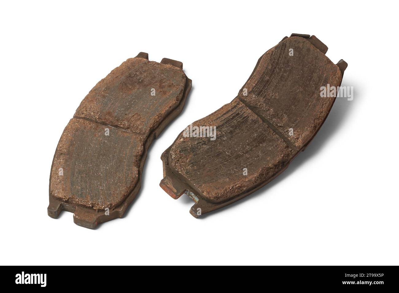 pair of old worn out car disc brake pads, components of vehicle braking system, made of friction materials that grip brake disc or rotor isolated Stock Photo