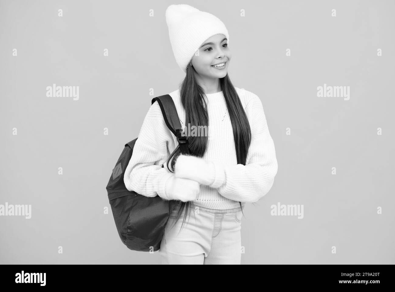 Cute little girls of 5 years old wearing knitted trendy winter clothes  posing over white brick wall Stock Photo - Alamy