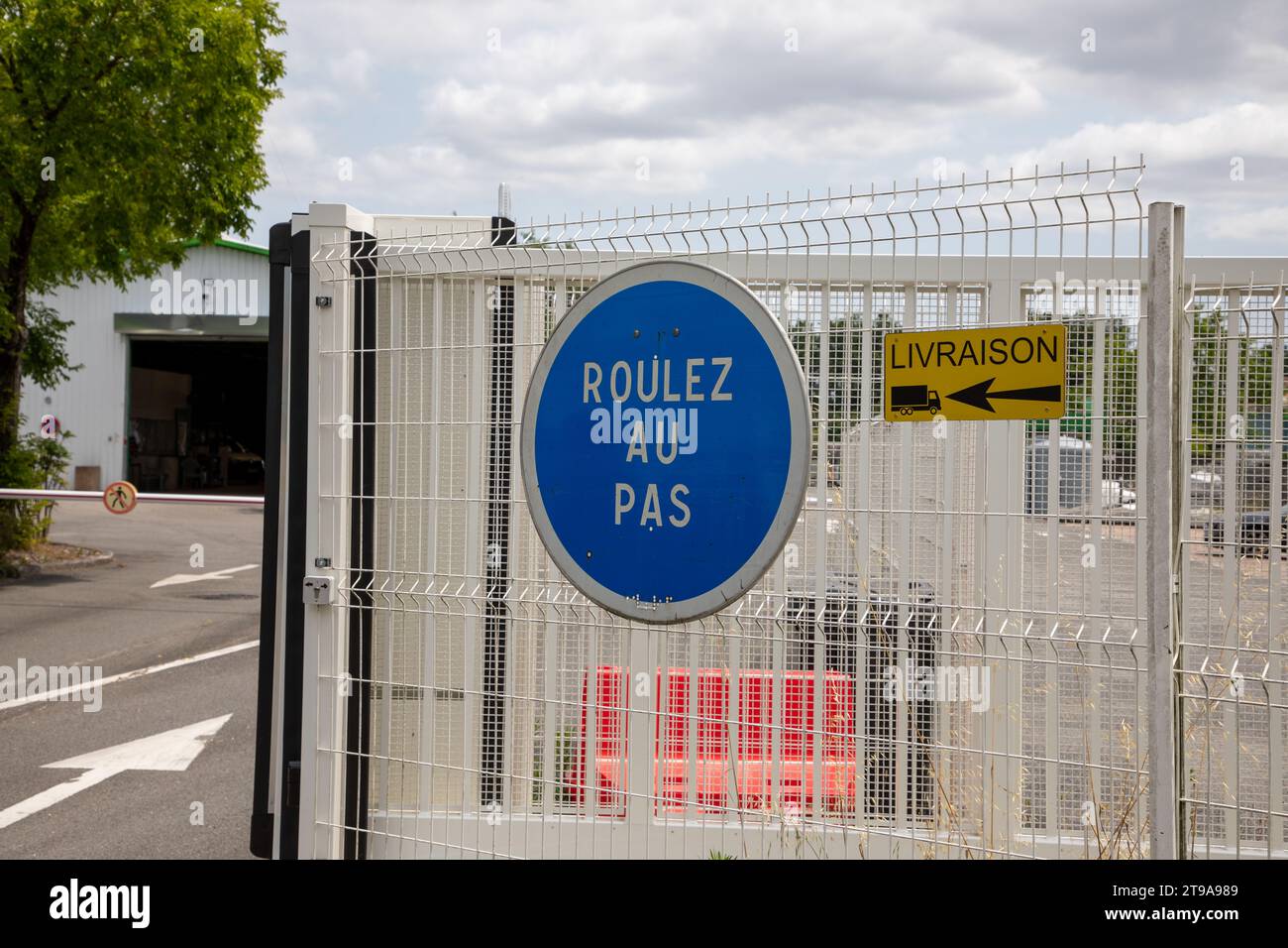 Drive slowly sign in France called means roulez au pas in french text
