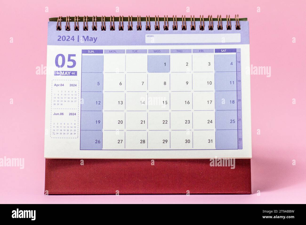 Desk calendar for May 2024 on a pink background Stock Photo Alamy
