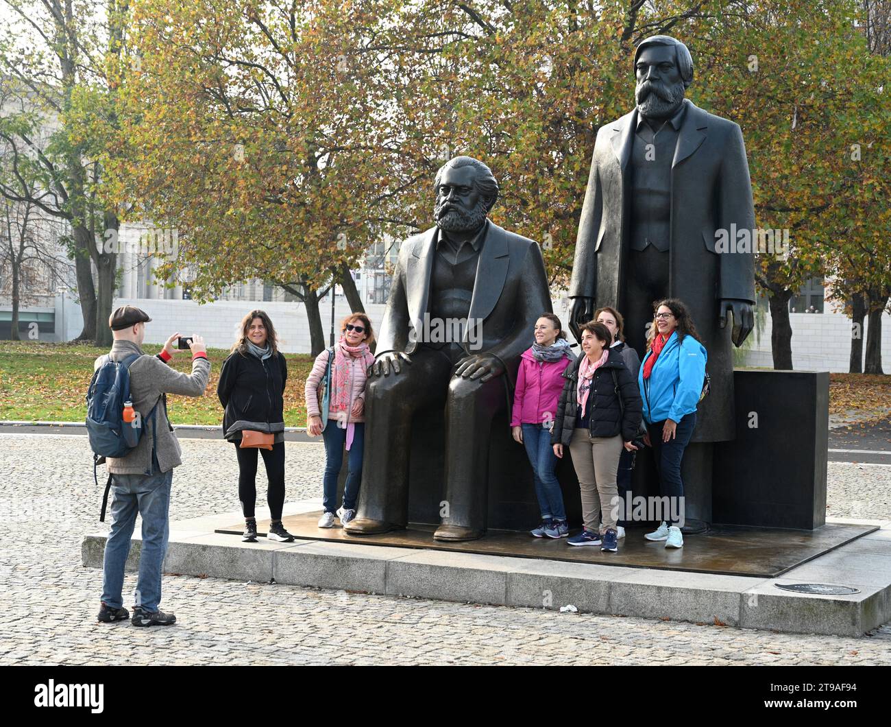 Berlin, Germany - October 31, 2022: People take pictures near the statue of Karl Marx and Friedrich Engels in Berlin. Stock Photo