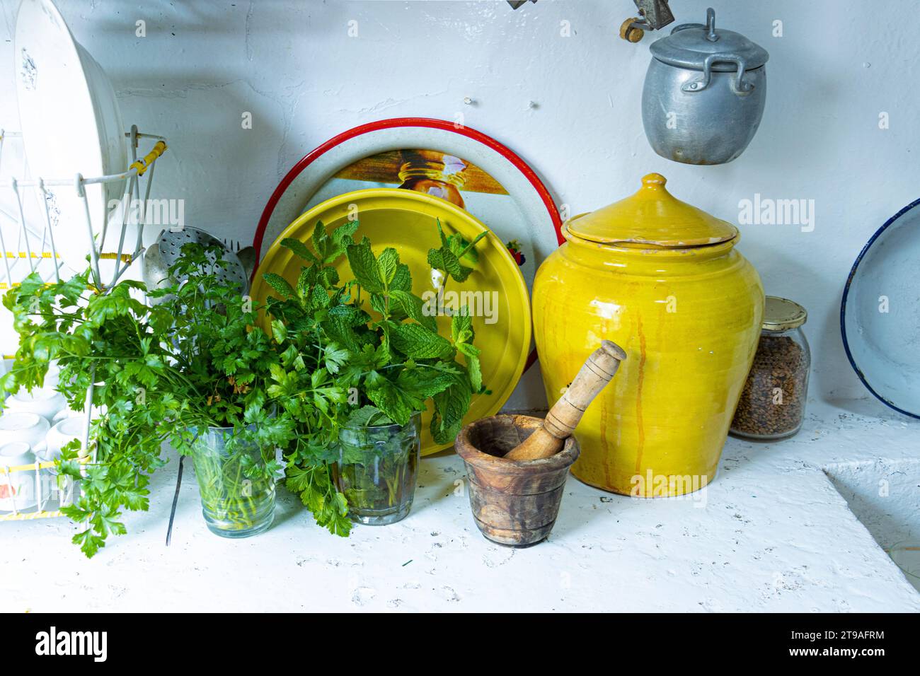 utensils for a traditional canarian kitchen. cauldrons and pans. aromatic herbs. Stock Photo