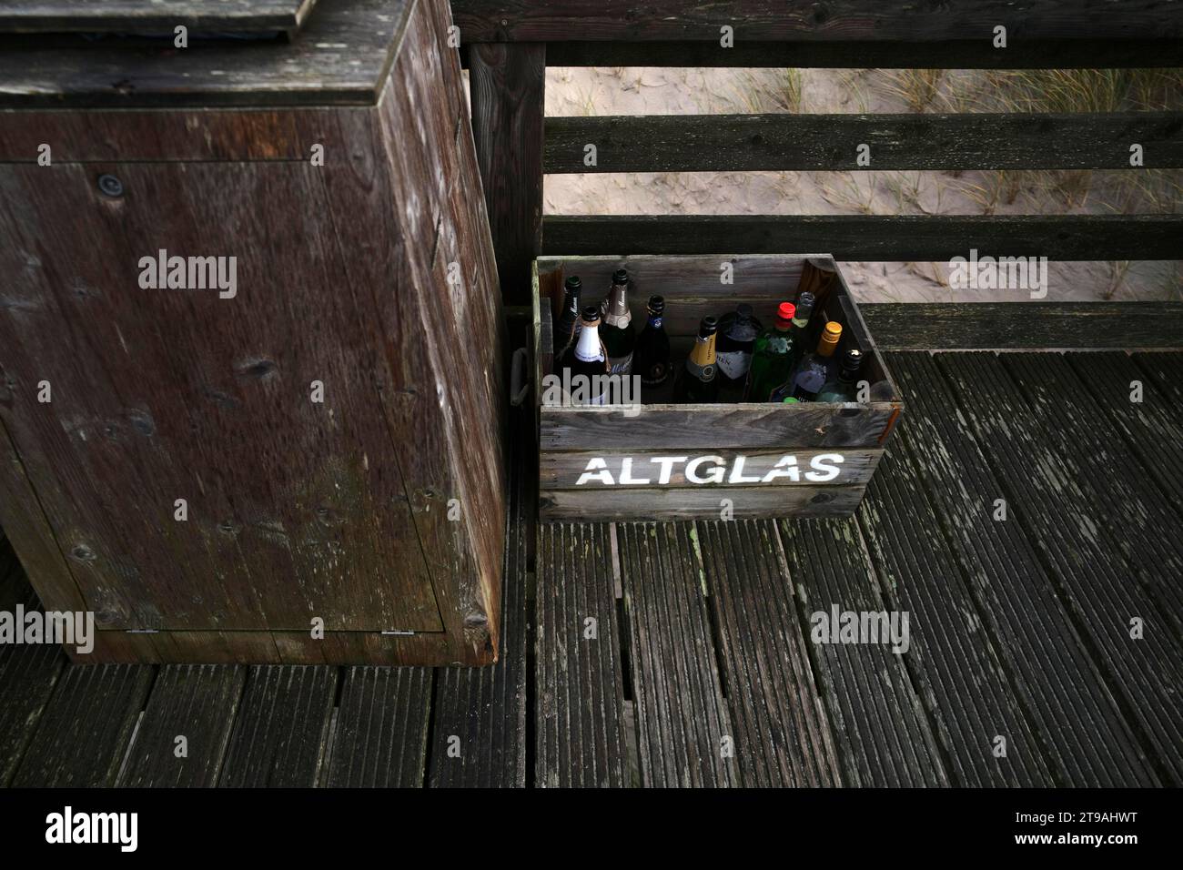 Empty champagne bottles in crate for disposal of waste glass, waste management, Uncle Johnny's beach farm, terrace, Rotes Klliff beach, Kampen, North Stock Photo