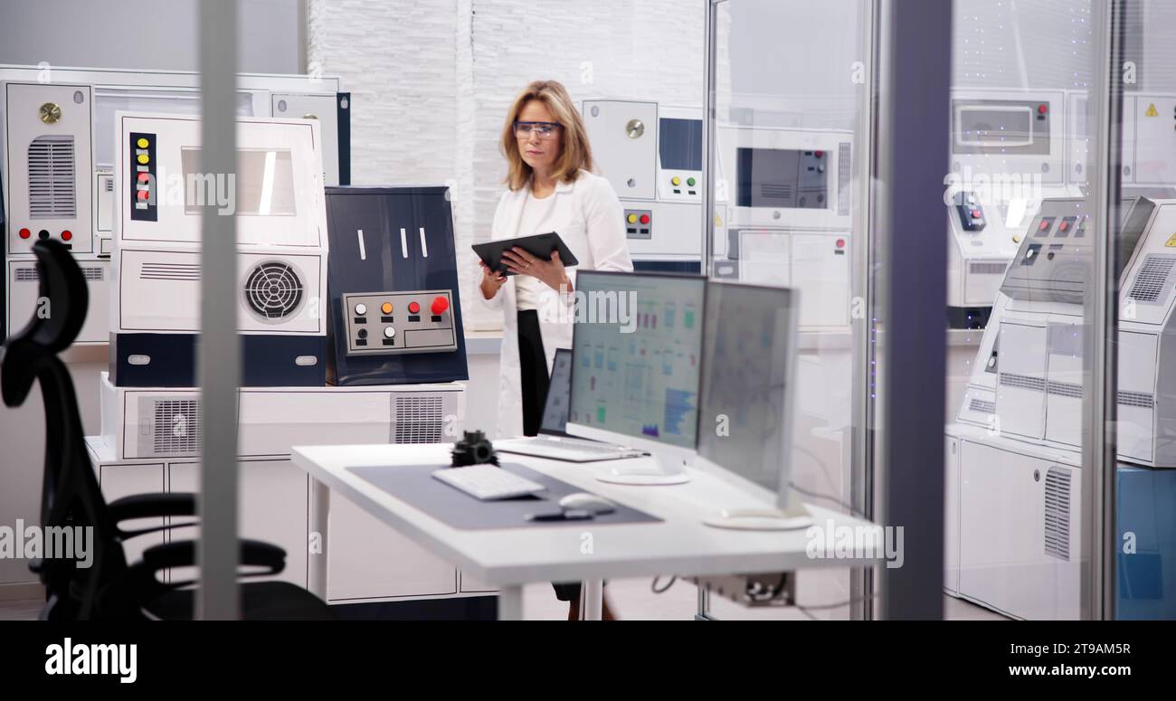 Engineer Using Medical Tablet in the Industry Factory: Innovative Engineering in the Medical Industry Stock Photo