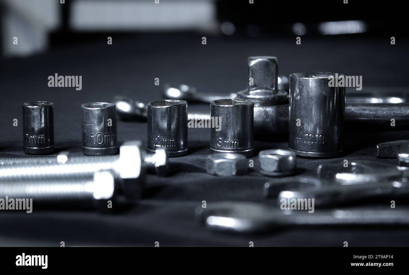 Variety Hardware Products On Black Workbench Closeup Angle View Stock Photo