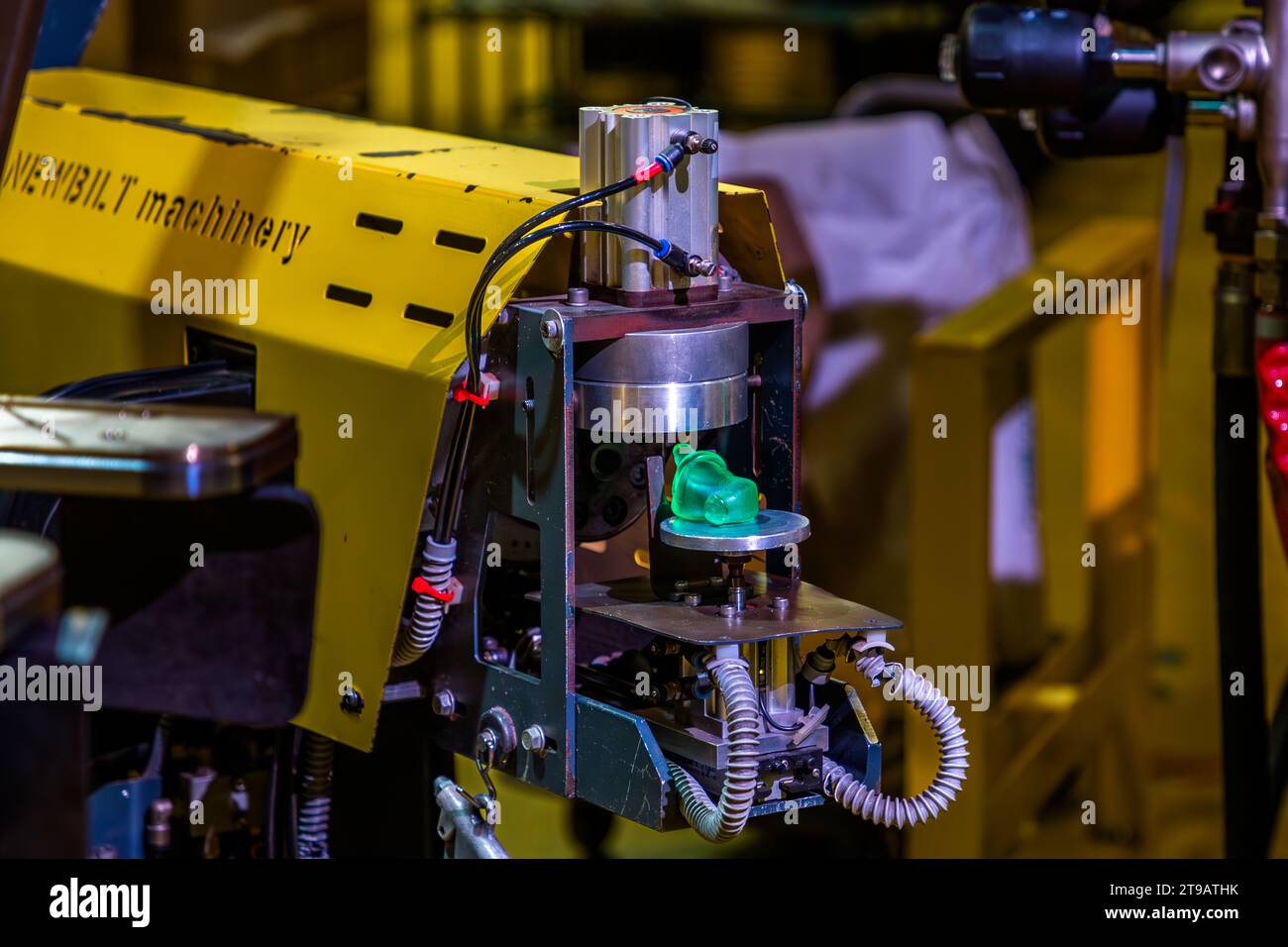 An extruder tempers the PVC and provides a precisely determined amount to a vinyl cake, which is naturally called a puck in an ice hockey area. Production site of the record label Third Man Records / Third Man Pressing in Detroit, United States. Third Man Pressing's vinyl manufacturing plant is located in Detroit's Cass Corridor. Vinyl pressing production facility of the record label Third Man Records / Third Man Pressing Stock Photo