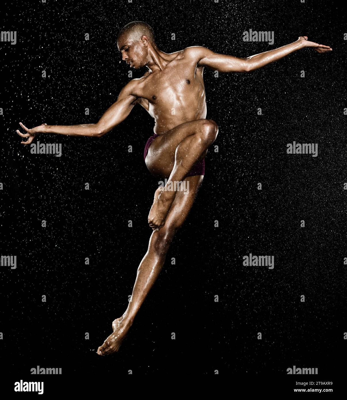 A dancer performing beautiful body controlled jumps with help from a ...