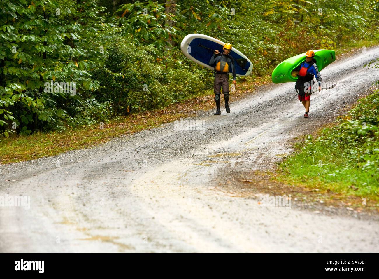Paddleboarder carrying board hi-res stock photography and images - Alamy