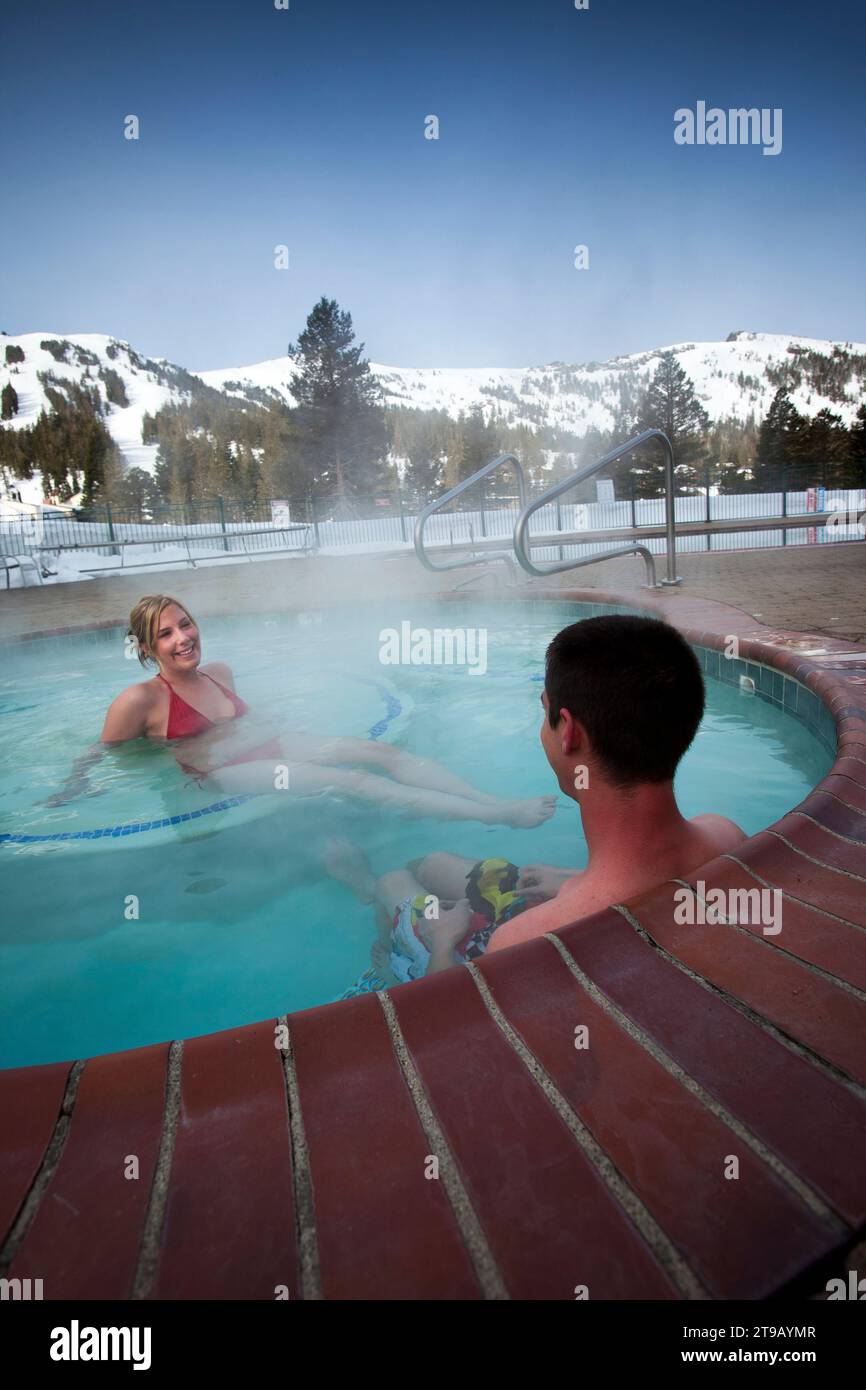 Young couple relaxing in a hot tub. Stock Photo