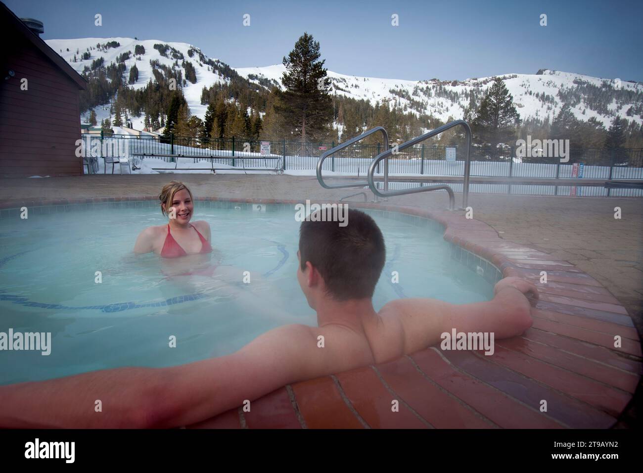 Young couple relaxing in a hot tub. Stock Photo