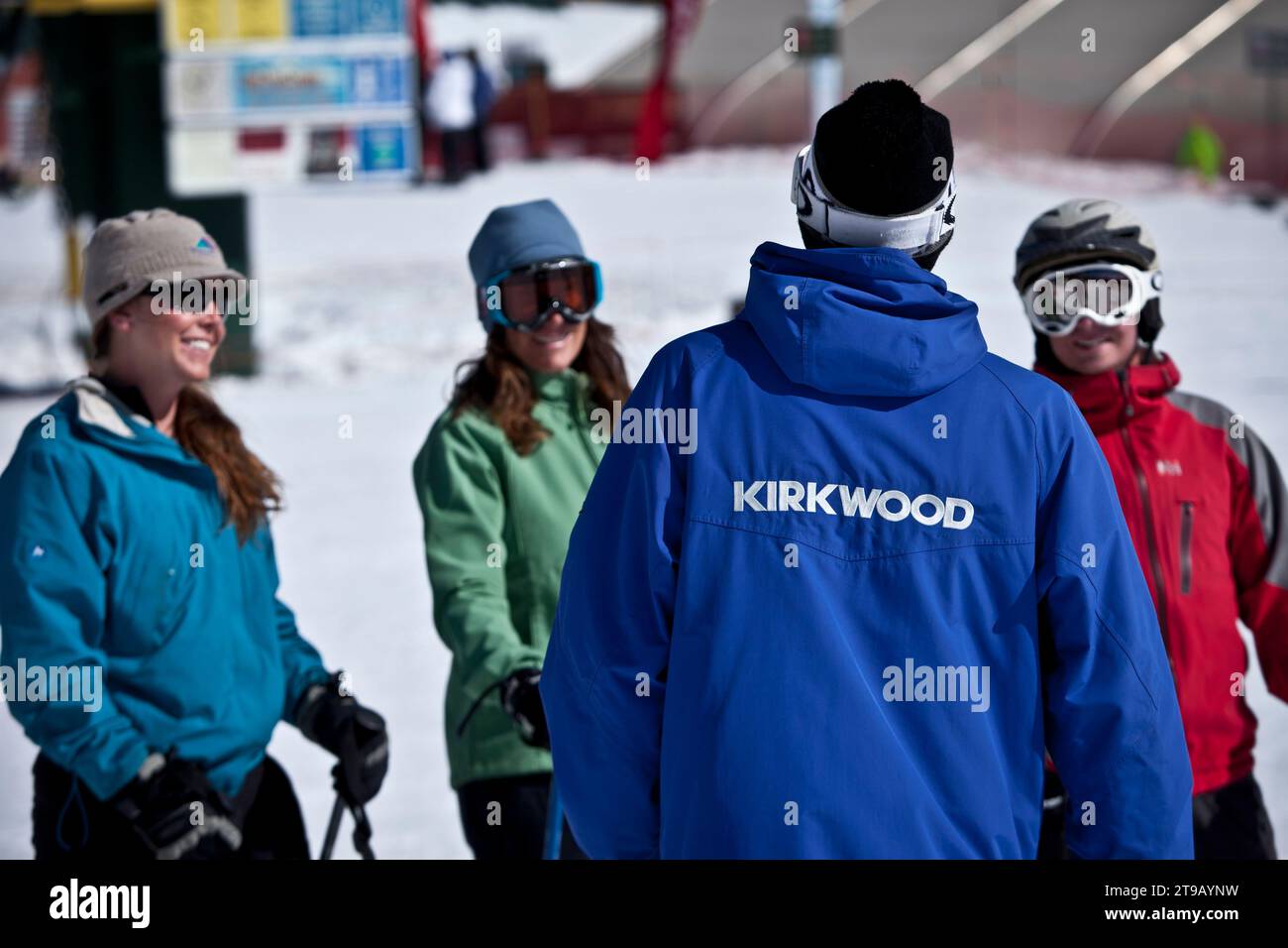 Ski students listening to their ski instructor. Stock Photo