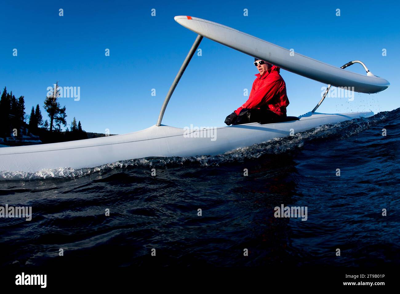 Jay Wild paddling the waves of Lake Tahoe on a cold January day in his