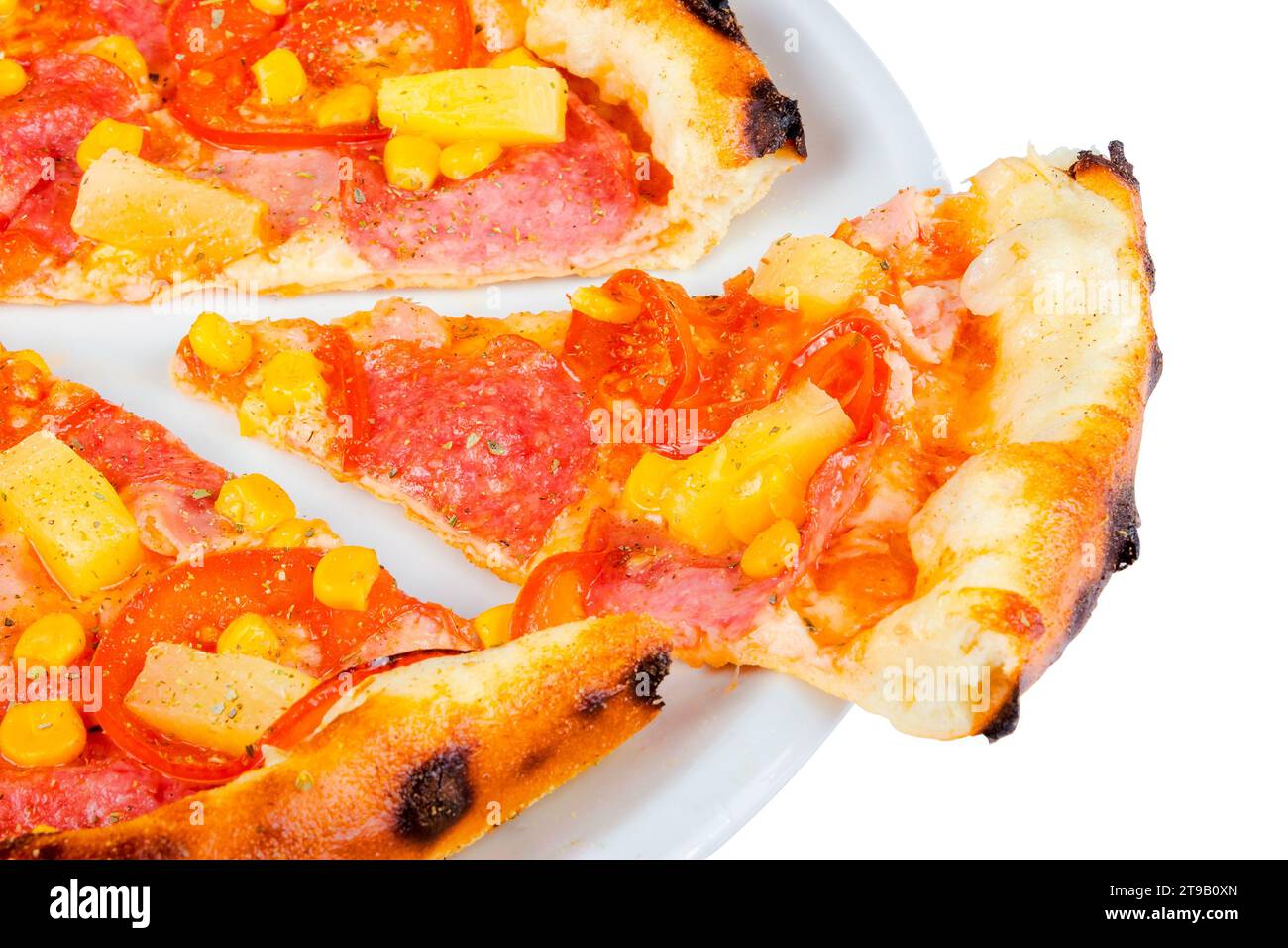 delicious slice of pizza with salami and pineapple on a white plate. isolated food closeup Stock Photo
