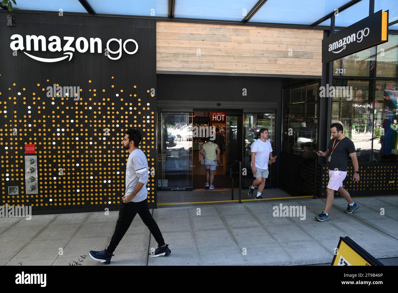 Seattle, WA, USA - August 3, 2023: People near the Amazon Go store in Seattle. Stock Photo