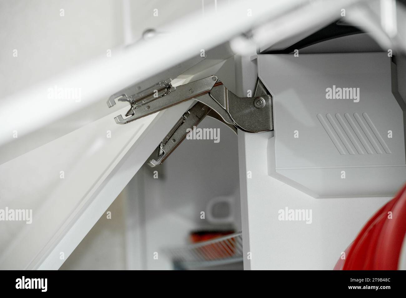 Modern door opening mechanism hinges with closers Stock Photo