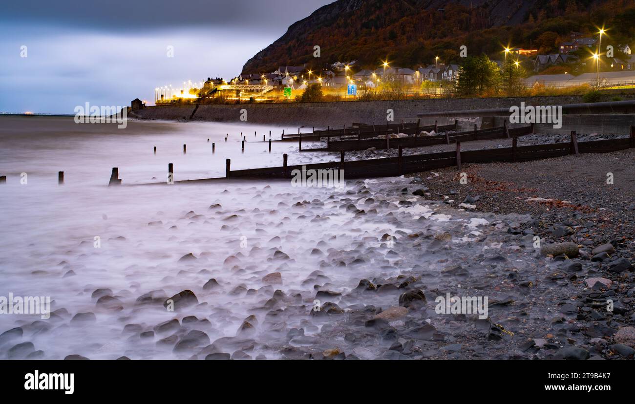 Llanfairfechan Beach, Conwy, North Wales. The lights at the top of the ...