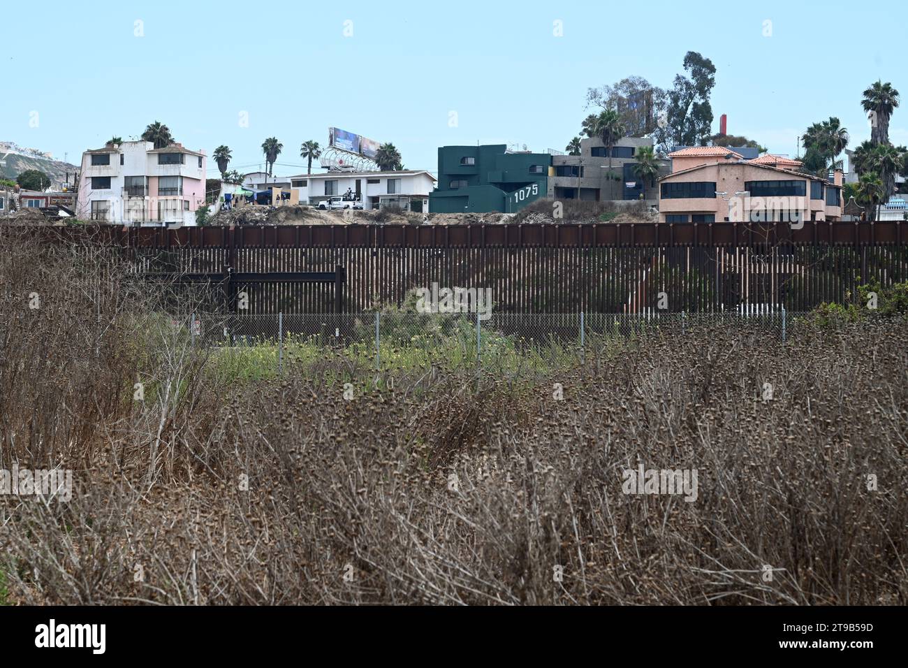 San Ysidro, CA, USA - July 30, 2023: The USA Mexico Border Wall near Border Field State Park Beach. Stock Photo