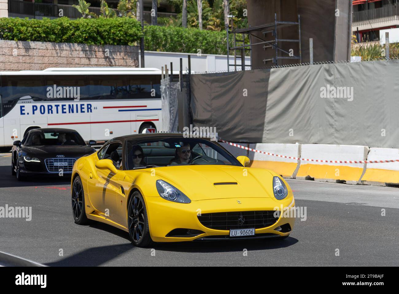 Monaco, Monaco - Yellow Ferrari California driving on the road in the Portier roundabout. Stock Photo