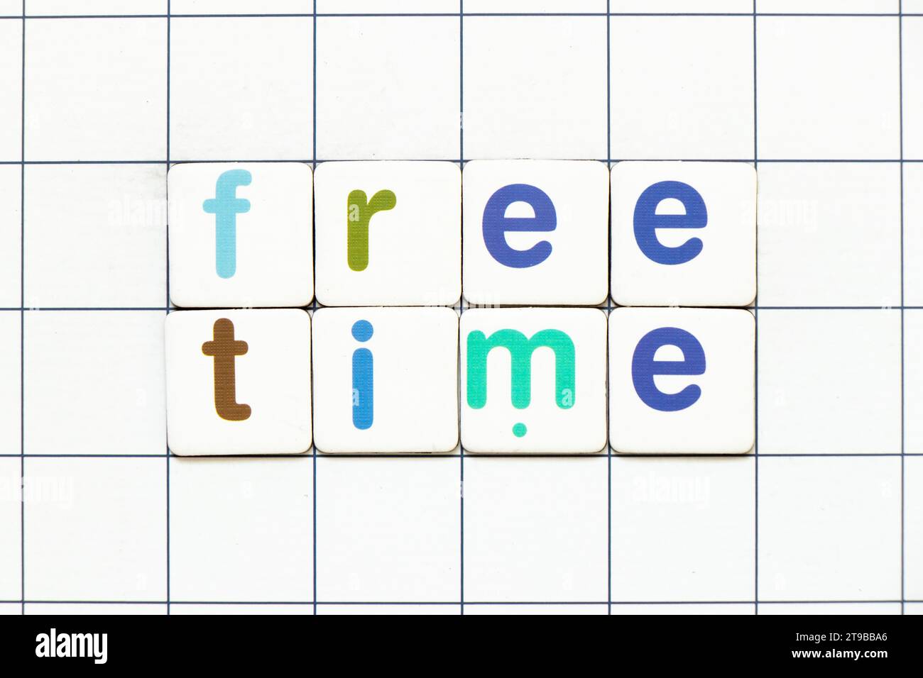 colorful-tile-letter-in-word-free-time-on-white-grid-background-stock