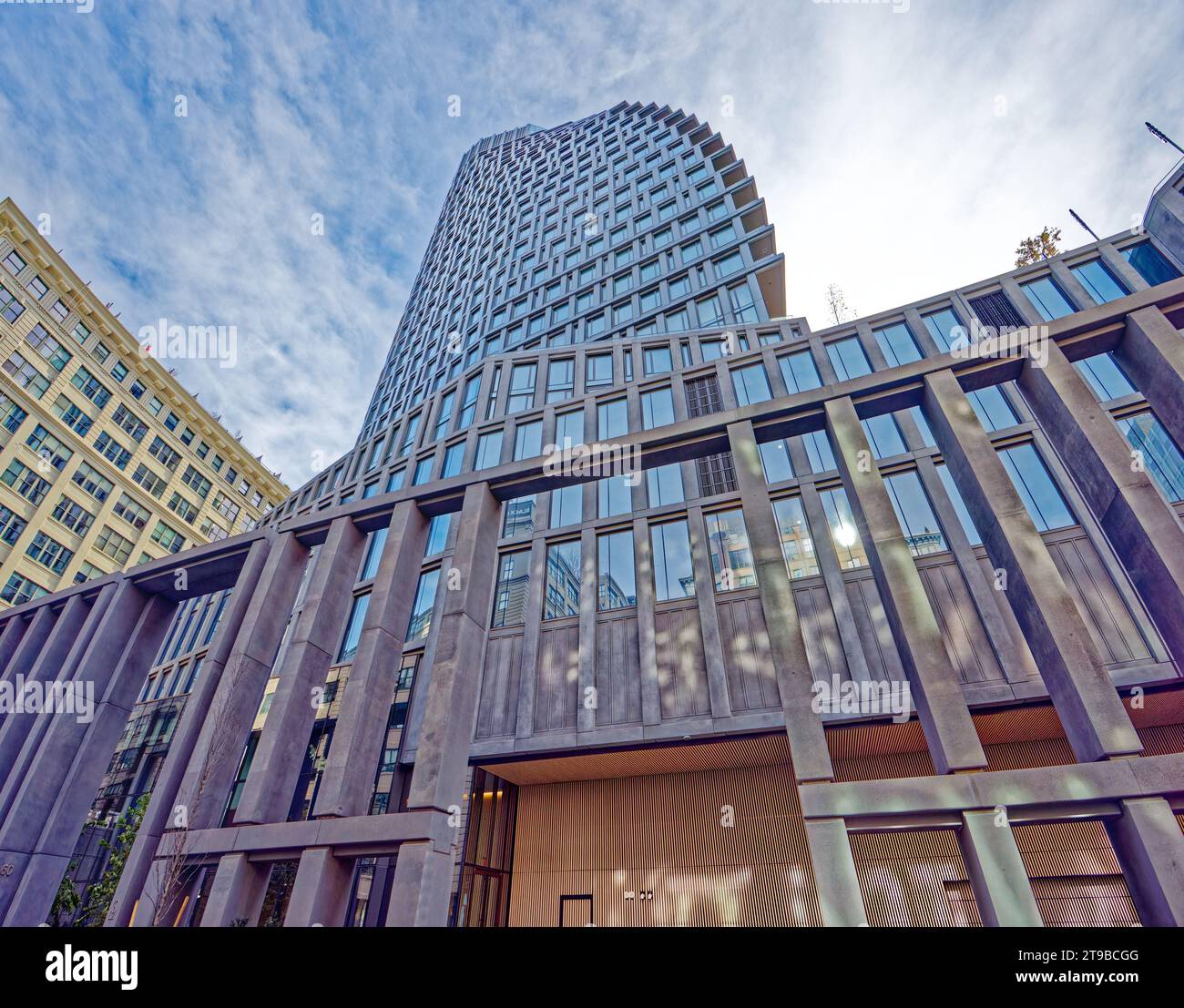 A threestory colonnade screens the front of Olympia DUMBO, the 33story sailshaped condo