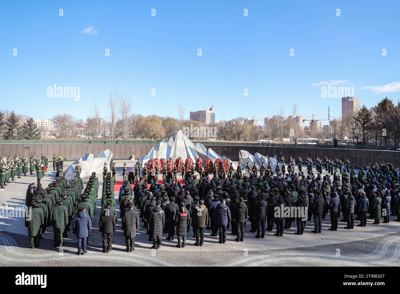 (231124) -- SHENYANG, Nov. 24, 2023 (Xinhua) -- This photo taken on Nov. 24, 2023 shows the burial ceremony for the remains of 25 Chinese People's Volunteers (CPV) martyrs at the CPV martyrs' cemetery in Shenyang, northeast China's Liaoning Province. The remains of 25 CPV soldiers killed in the War to Resist U.S. Aggression and Aid Korea (1950-1953) were buried Friday in a cemetery in Shenyang.The remains of the fallen soldiers were returned to China from the Republic of Korea on Thursday. It was the 10th such repatriation since 2014, following a handover agreement signed between the two count Stock Photo