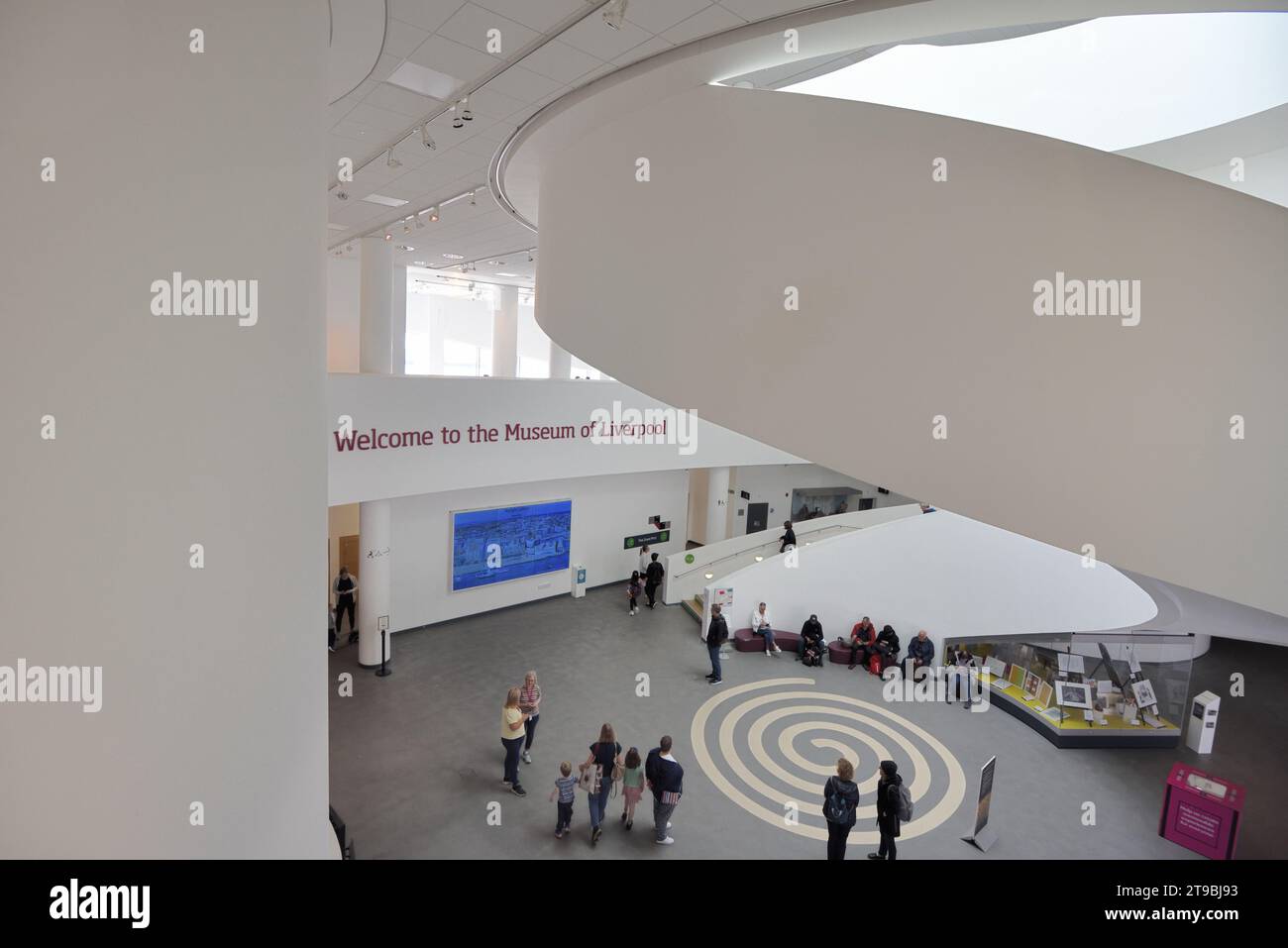 Tourists, Visitors, Spiral Staircase & Entrance Hall, Museum of Liverpool (2011), designed by 3XN Architects, on the Pier Head, Liverpool Stock Photo