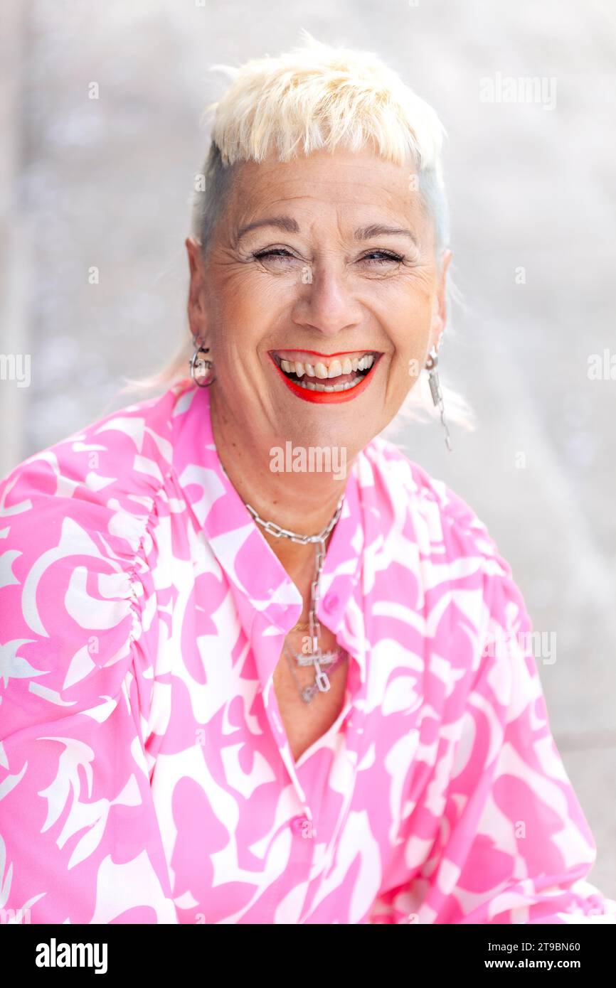 Happy positive mature blond hi-res stock photography and images - Alamy
