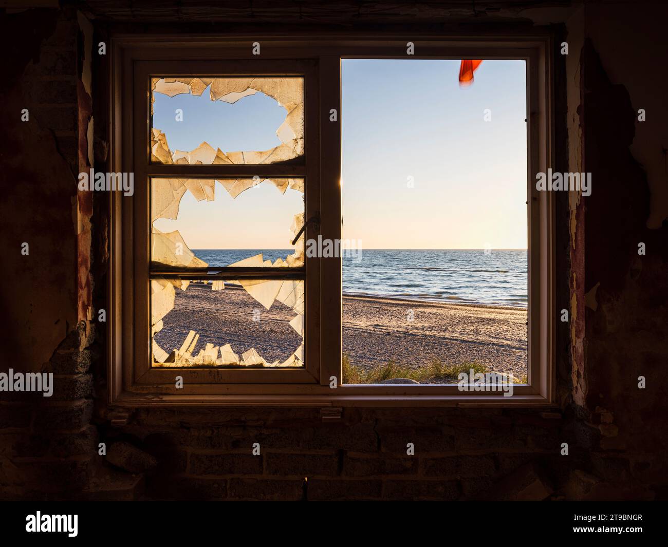 View on sea from abandoned house window Stock Photo