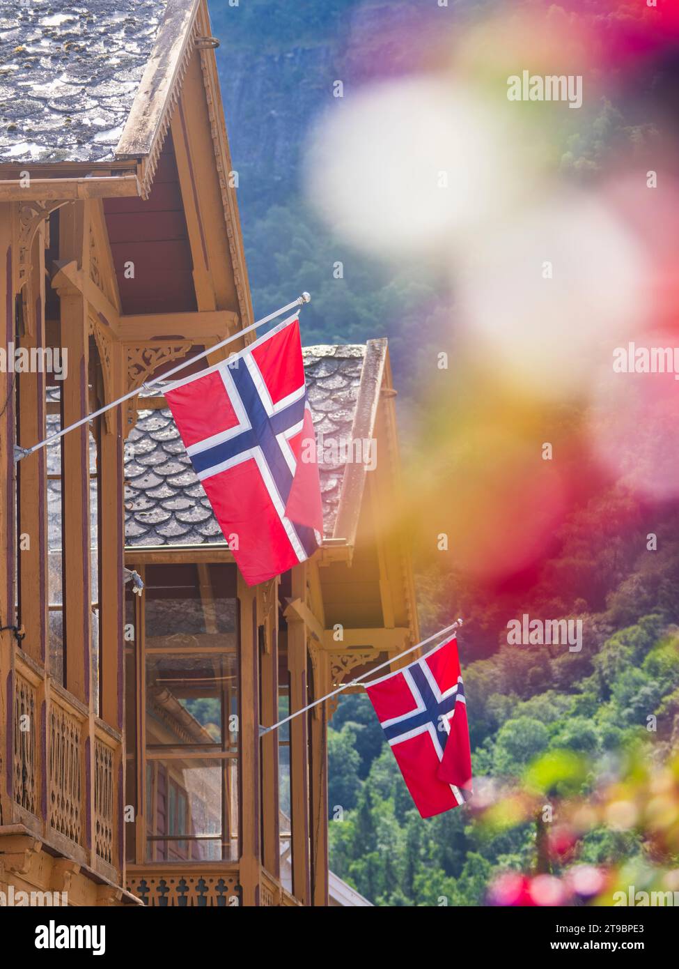 Low angle view of Danish flags at wooden house Stock Photo