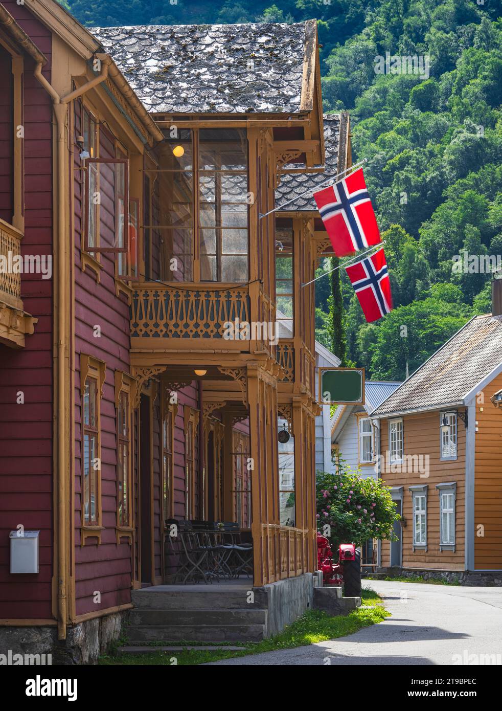 View of wooden house with Danish flags on porch Stock Photo