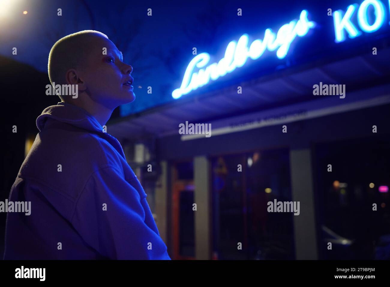 Young woman at night looking away Stock Photo