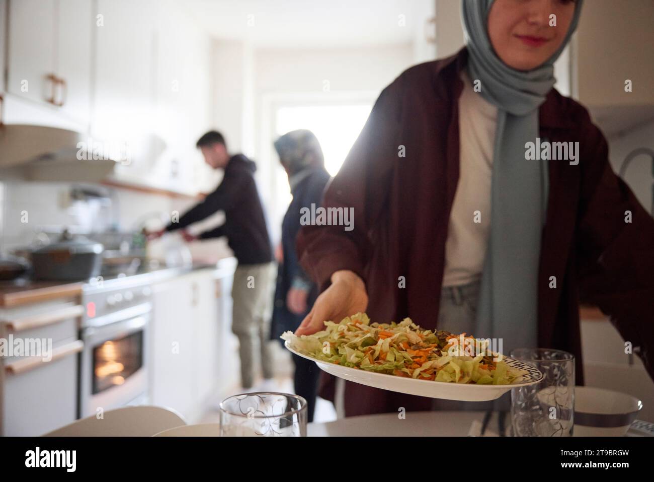 Family cooking together for eid al-fitr at home Stock Photo
