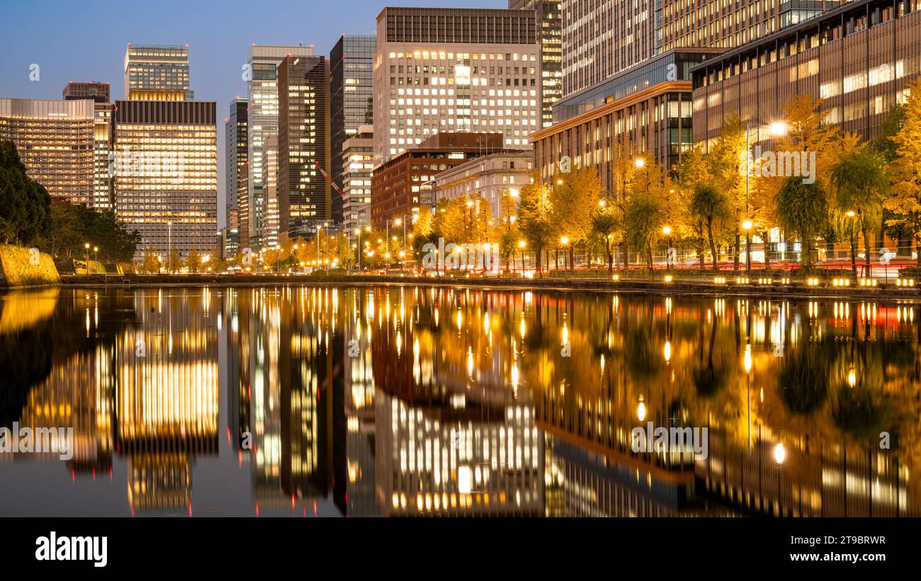 Night view of Marunouchi and Hibiya in Tokyo with water reflection during autumn Stock Photo