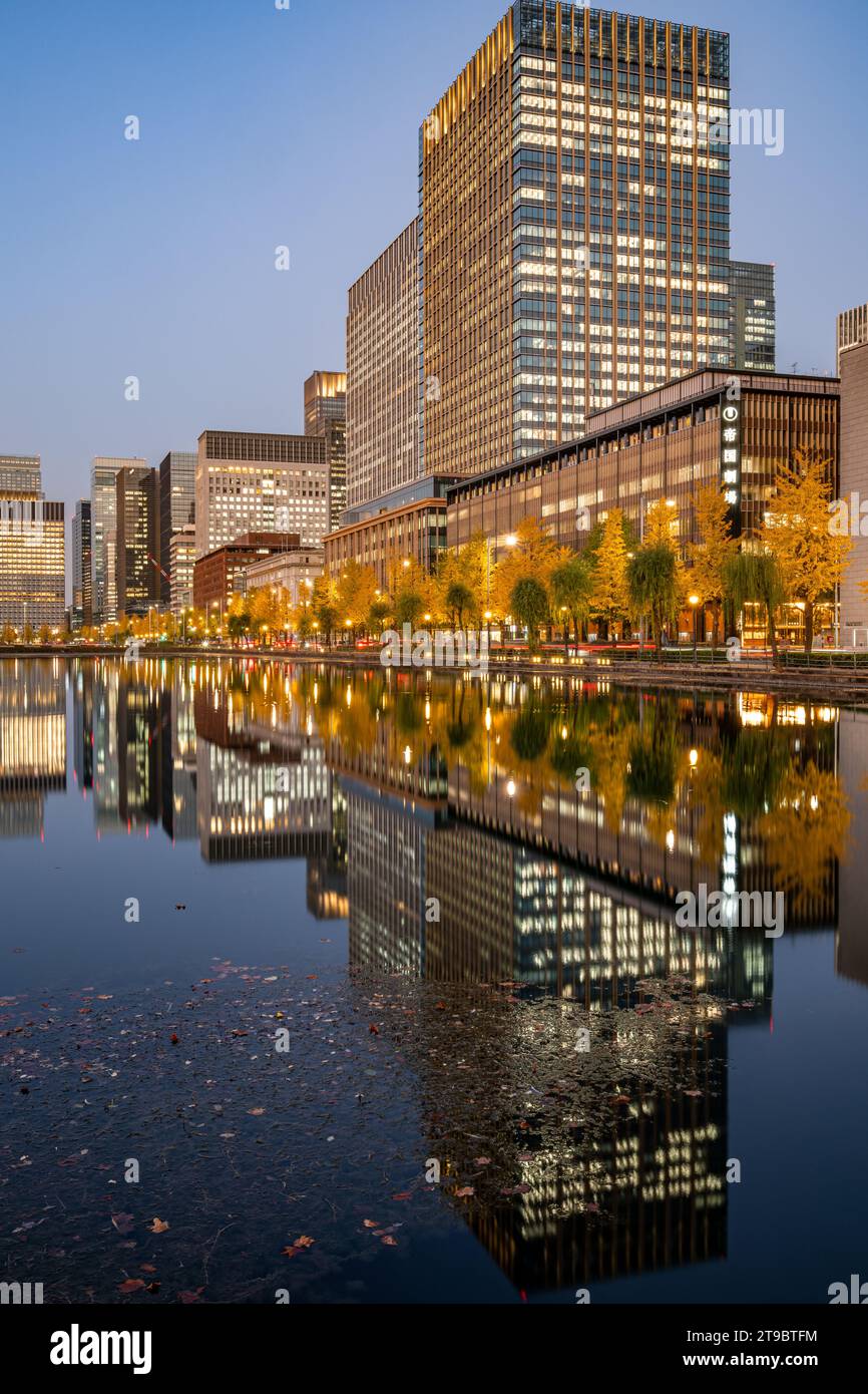 Night view of Marunouchi and Hibiya in Tokyo with water reflection during autumn Stock Photo